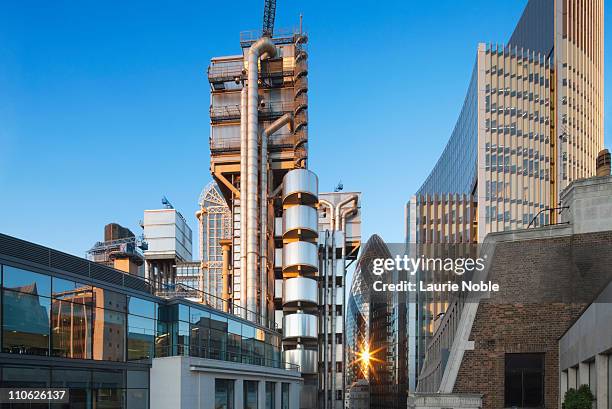 city buildings at sunset; london - lloyds of london stock-fotos und bilder