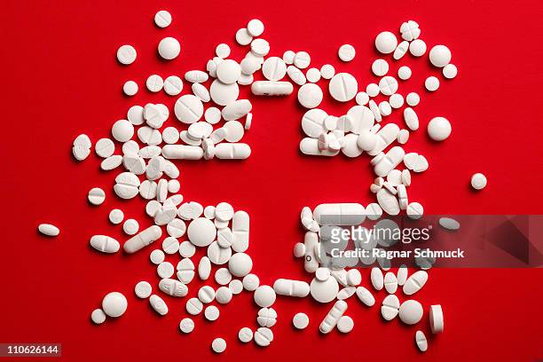 pills cross - red cross stock pictures, royalty-free photos & images