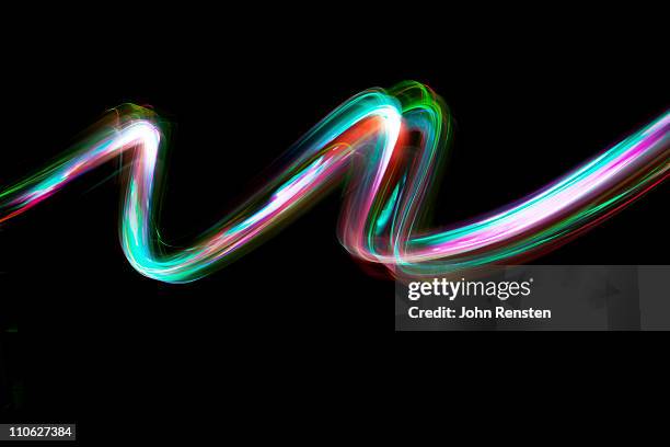 abstract coloured light energy motion trails - light painting stockfoto's en -beelden