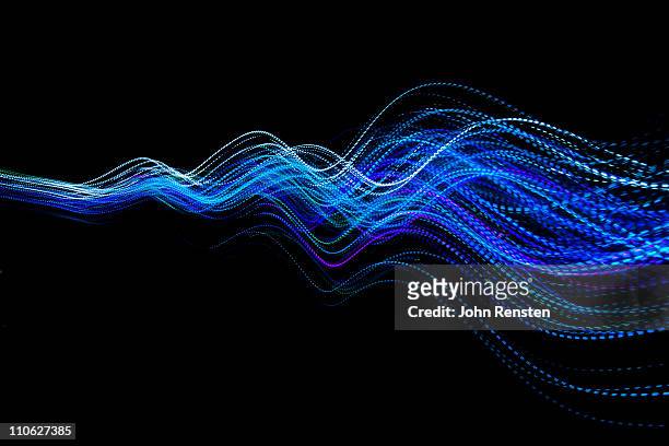 abstract coloured light energy motion trails - energy abstract stock pictures, royalty-free photos & images