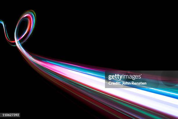 abstract coloured light energy motion trails - light painting stock pictures, royalty-free photos & images