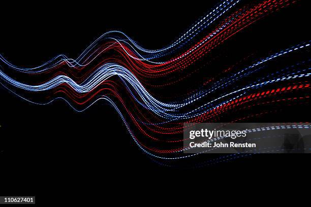 abstract coloured light energy motion trails - esposizione lunga foto e immagini stock