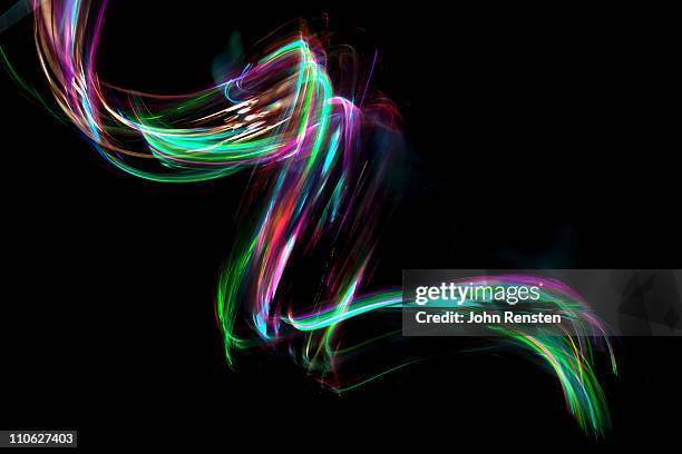 abstract coloured light energy motion trails - light painting stockfoto's en -beelden