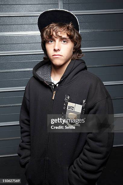 portrait of serious teenage boy - hoodie boy stock pictures, royalty-free photos & images