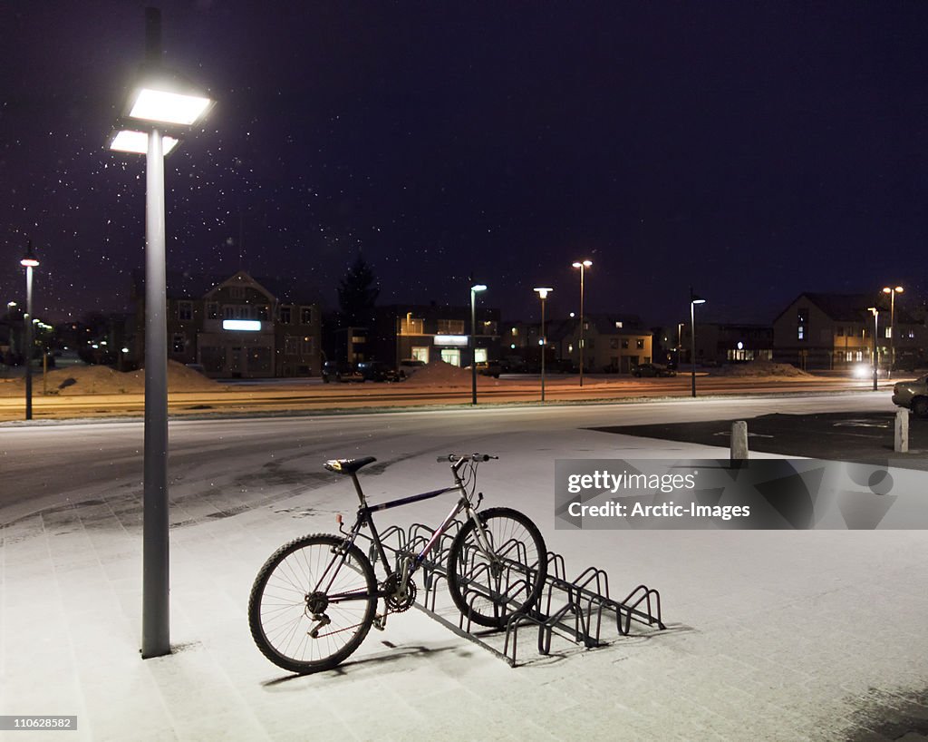 Bicycle on rack in winter, Akureyri, Iceland