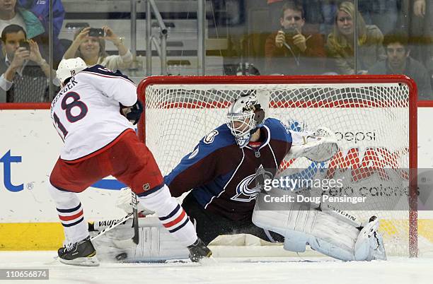 Goalie Brian Elliott of the Colorado Avalanche makes a save on a shot by R.J. Umberger of the Columbus Blue Jackets during their overtime shootout at...