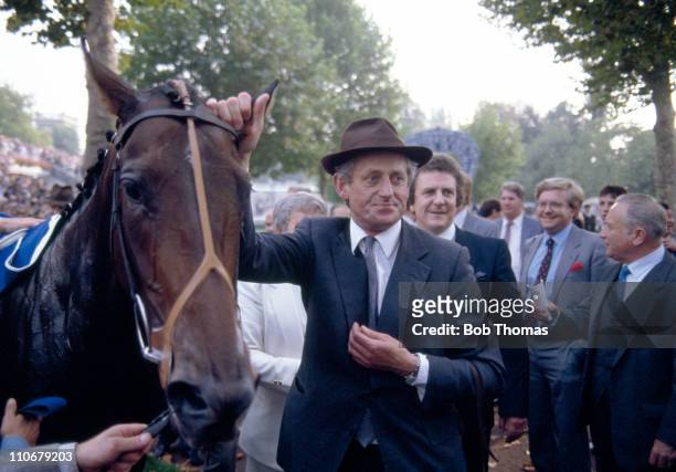 Dancing Brave with trainer Guy Harwood after winning the Prix de l'Arc de Triomphe at Longchamp on 5th October 1986.