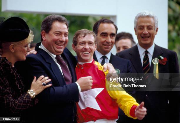 John Reid, winner of the Prix de l'Arc de Triomphe at Longchamp on Tony Bin, and the husband of the horse's owner, Luciano Gaucci celebrate their...