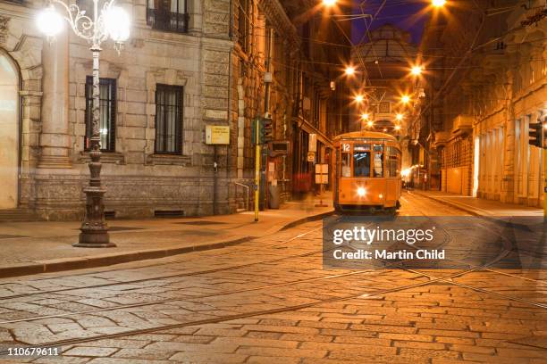 old tram on milan street at night - tram foto e immagini stock