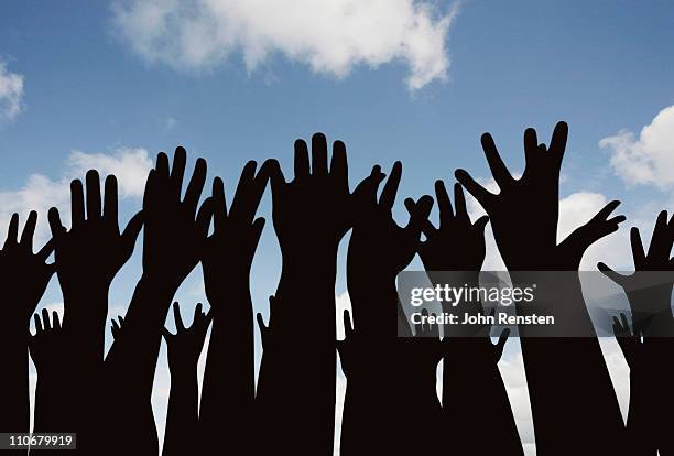 demonstration or festival? hands in the air - rassemblement politique photos et images de collection