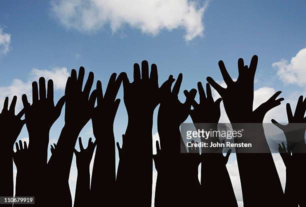 demonstration or festival? hands in the air - participant stock pictures, royalty-free photos & images