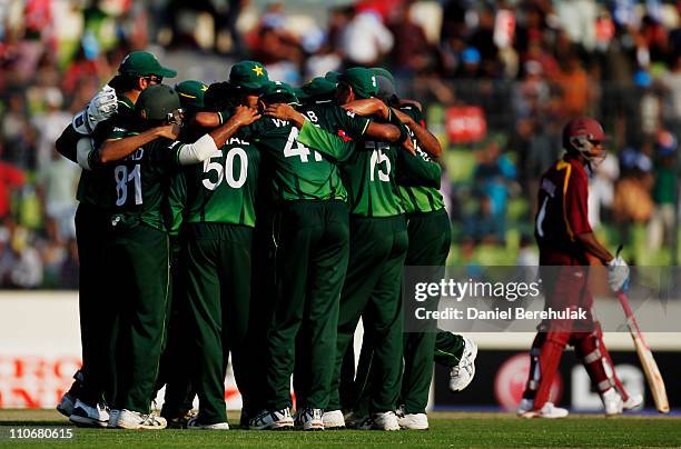 Players of Pakistan celebrate after taking the wicket of Davendra Bishoo of West Indies during the 1st quarterfinal of the ICC Cricket World Cup at...