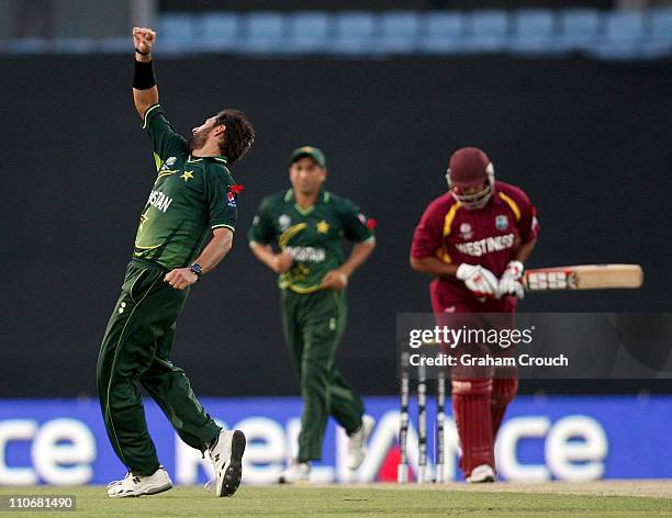 Shahid Afridi of Pakistan celebrates the wicket of Ravi Rampaul of West Indies during the first ICC 2011 World Cup quarter final at Shere-e-Bangla...