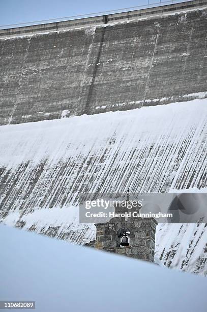 Church stands downstream to the Grande Dixence Dam on March 22, 2011 in Heremence, Switzerland. Opened in 1965 after 15 years of construction,...