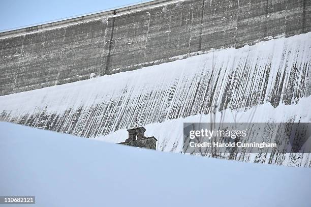 Church stands downstream to the Grande Dixence Dam on March 22, 2011 in Heremence, Switzerland. Opened in 1965 after 15 years of construction,...