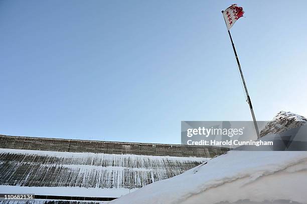 The Valais flag flies next to the Grande Dixence Dam on March 22, 2011 in Heremence, Switzerland. Opened in 1965 after 15 years of construction,...