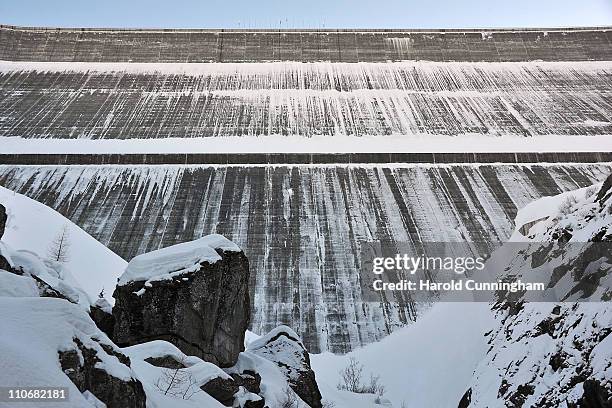 Snow covers the Grande Dixence Dam on March 22, 2011 in Heremence, Switzerland. Opened in 1965 after 15 years of construction, measuring 285 metres...