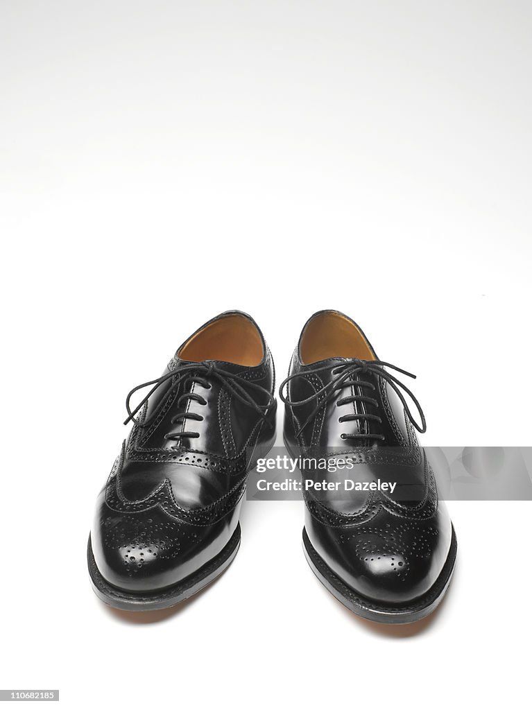 Close up of black brogue shoes with copy space
