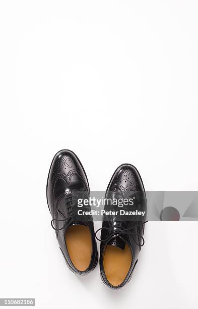 pair of black brogue shoes with copy space - schuhe von oben stock-fotos und bilder