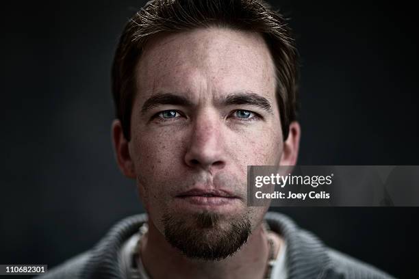 portrait of man - young caucasian man on black stock pictures, royalty-free photos & images