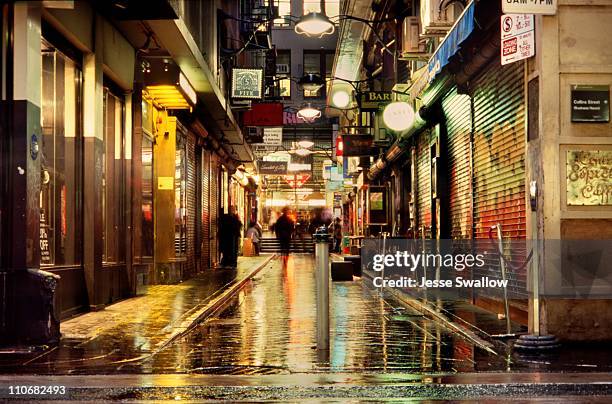 wet city lane by night - melbourne city at night ストックフォトと画像