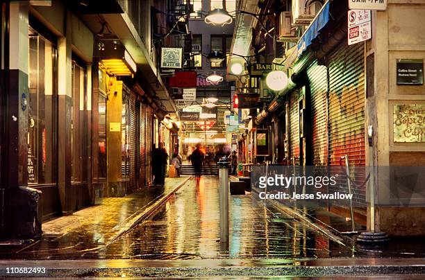 wet city lane by night - melbourne australia stock pictures, royalty-free photos & images