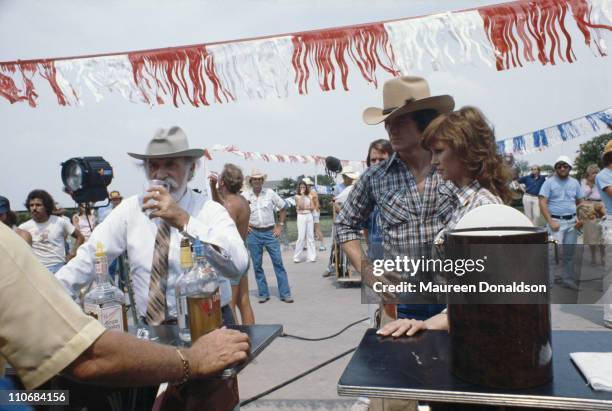 Actors Keenan Wynn, Patrick Duffy and Victoria Principal on the set of the TV soap 'Dallas', 18th July 1979.