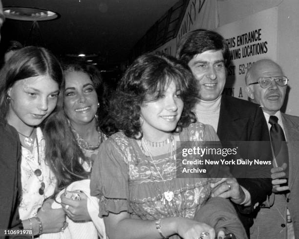 Elizabeth Taylor with her daughter Maria, and boyfriend Henry Weinberg, attend show "Candide".