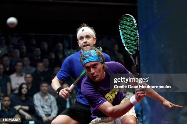 James Willstrop of England in action against Joey Barrington of England in action during their Quarter Final match in the ISS Canary Wharf Squash...