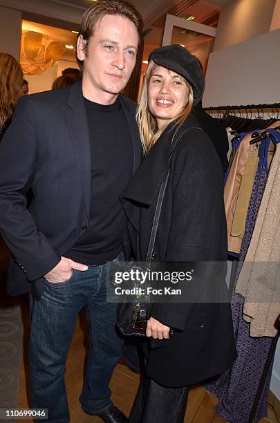 Benoit Magimel and Nikita aka Nathalie Lespinasse attend the Gerard Darel Flagship Opening With Robin Wright on March 9 2011 in Paris, France.