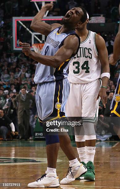 Tony Allen of the Memphis Grizzlies celebrates the win as Paul Pierce of the Boston Celtics stands by on March 23, 2011 at the TD Garden in Boston,...