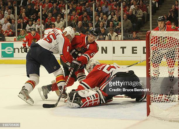 Duncan Keith of the Chicago Blackhawks and goaltender Corey Crawford of the Chicago Blackhawks defend the net against Jack Skille of the Florida...
