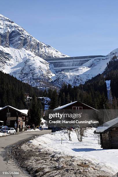 Snow covers the roofs of chalets in the downstream village of the Grande Dixence Dam on March 22, 2011 in Heremence, Switzerland. Opened in 1965...