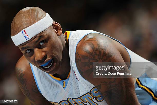 Al Harrington of the Denver Nuggets looks on as he awaits a free throw against the San Antonio Spurs at the Pepsi Center on March 23, 2011 in Denver,...