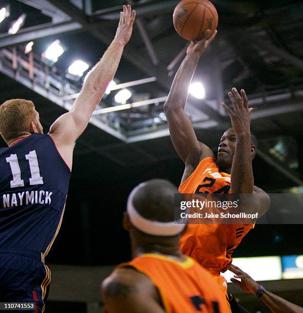 Marcus Hubbard of the New Mexico Thunderbirds shoots over the defense of Drew Naymick of the Bakersfield Jam during the game on March 23, 2011 at the...