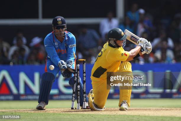 Shane Watson of Australia is bowled by Ravichandran Ashwin during the 2011 ICC World Cup Quarter-Final match between Australia and India at the...