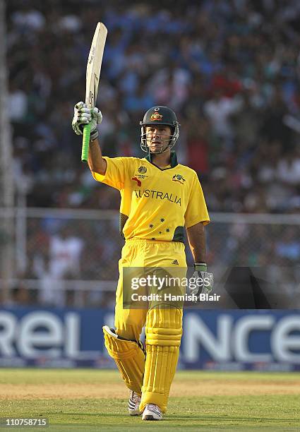 Ricky Ponting of Australia reaches his century during the 2011 ICC World Cup Quarter Final match between Australia and India at Sardar Patel Stadium...