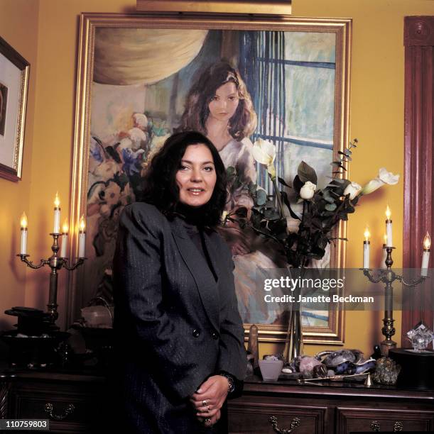 Maria Burton, the adopted daughter of Elizabeth Taylor and Richard Burton, at home, in front of a painting of Elizabeth Taylor, New Jersey, 2003.