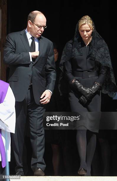 Prince Albert II of Monaco and Charlene Wittstock attend the funeral of Princess Melanie-Antoinette at Cathedrale Notre-Dame-Immaculee de Monaco on...