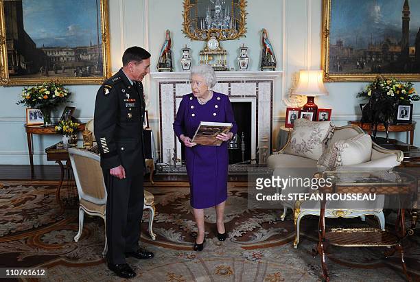 Britain's Queen Elizabeth II meets General David Petraeus, Commander of the NATO International Security Assistance Force and US Forces Afghanistan,...