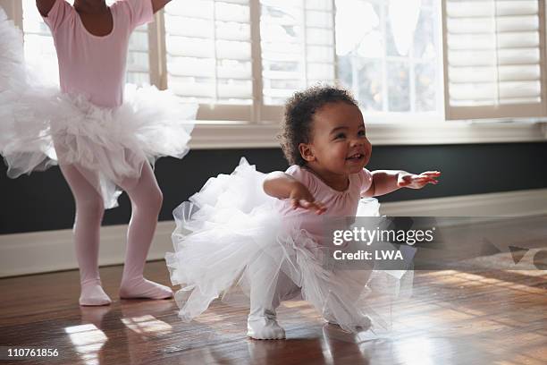 toddler in tutu, practicing dance moves - menina fantasia bonita imagens e fotografias de stock