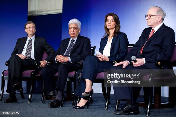 Left to right, Bill Gates, co-chairman of the Bill & Melinda Gates Foundation, Azim Hasham Premji, chairman and chief executive officer of Wipro...