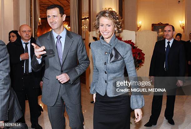 Syrian President Bashar al-Assad , his wife Asma visit the exhibition dedicated to French painter Claude Monet at the Grand Palais on December 11,...