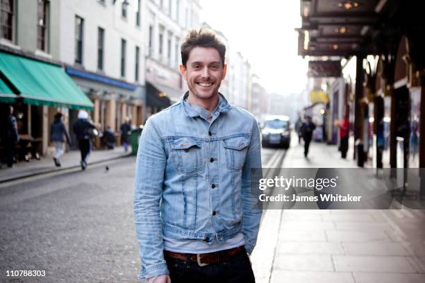 urban male in city street - man in denim jacket stock pictures, royalty-free photos & images