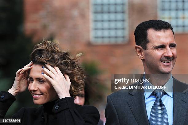 Syrian President Bashar al-Assad and his wife Asma attend on November 9, 2010 an official welcoming ceremony in Sofia. It is the first visit to...
