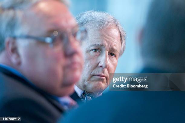 Matthew Winkler, editor-in-chief and co-founder of Bloomberg News, center, and Howard Buffett, president of the Howard G. Buffett Foundation and son...