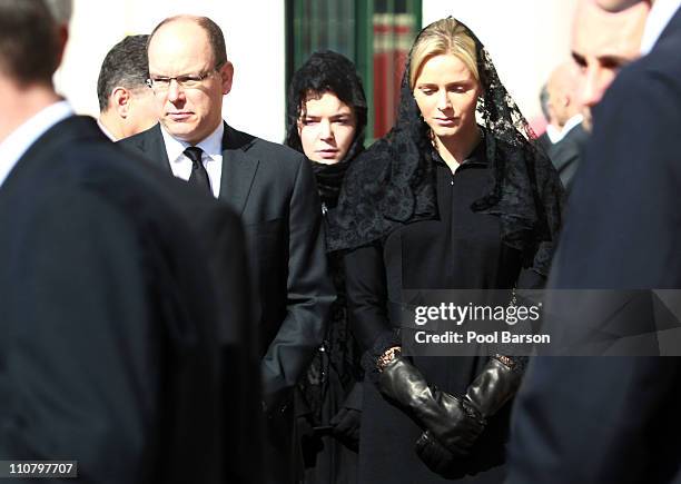 Prince Albert II of Monaco, Melanie-Antoinette de Massy and Charlene Wittstock attend Princess Melanie-Antoinette Funerals at Cathedrale...
