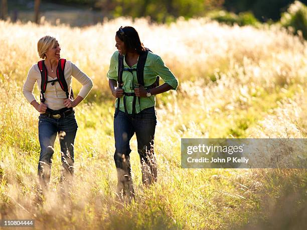 two women hiking and laughing - hiking colorado stock pictures, royalty-free photos & images