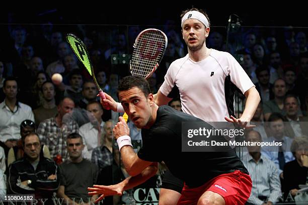 Peter Barker of England and James Willstrop of England in action during their Semi Final match at the ISS Canary Wharf Squash Classic at East Winter...