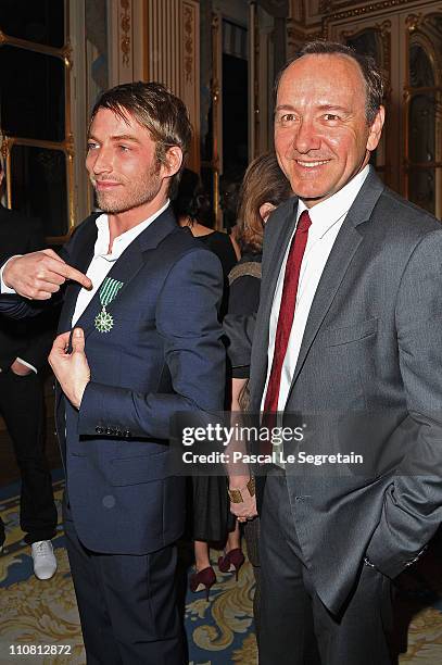 Ora Ito poses with Kevin Spacey after being awarded Chevalier des Arts et des Lettres during the 30th Anniversary of 'La Nuit Des Publivores' at...